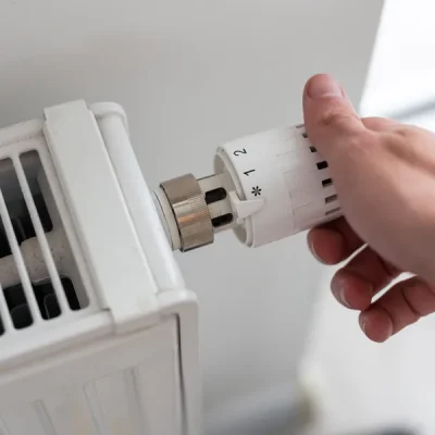 man-s-hand-holding-the-regulation-knob-of-domestic-2025-01-10-02-24-37-utc